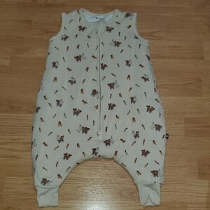 Larkspur Soft Cream Sleeveless Baby Romper with Playful Print Bunny Easter